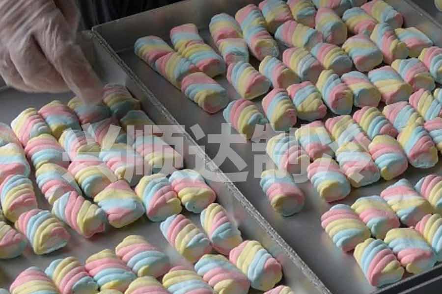 Marshmallows arranged on trays before candy freeze dryer processing